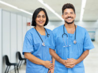 two nurse smile on the camera